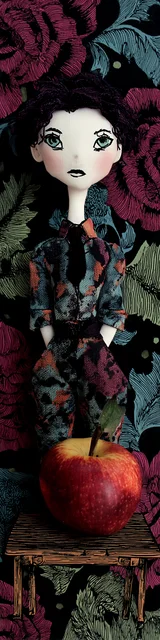 Free teacher bookmark featuring a dark red-haired teacher with a big apple on a table